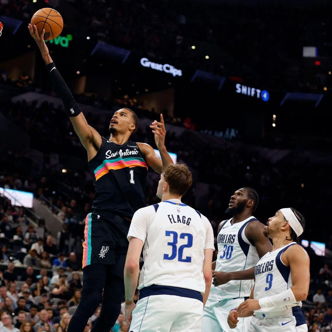 Victor Wembanyama scores on the Dallas Mavericks in the second half at Frost Bank Center on April 10.