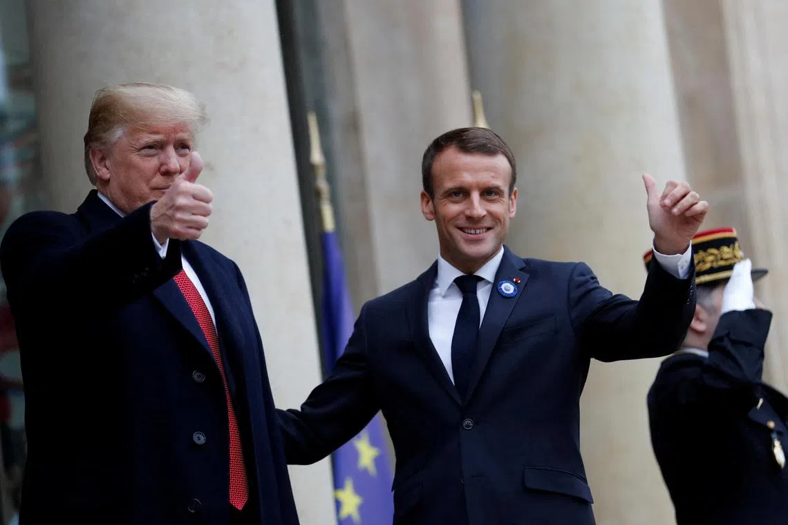 FILE PHOTO: U.S. President Donald Trump and French President Emmanuel Macron gesture as they meet at Elysee presidential palace, as part of the commemoration ceremony for Armistice Day, 100 years after the end of the First World War, in Paris, France, November 10, 2018. REUTERS/Carlos Barria/File Photo