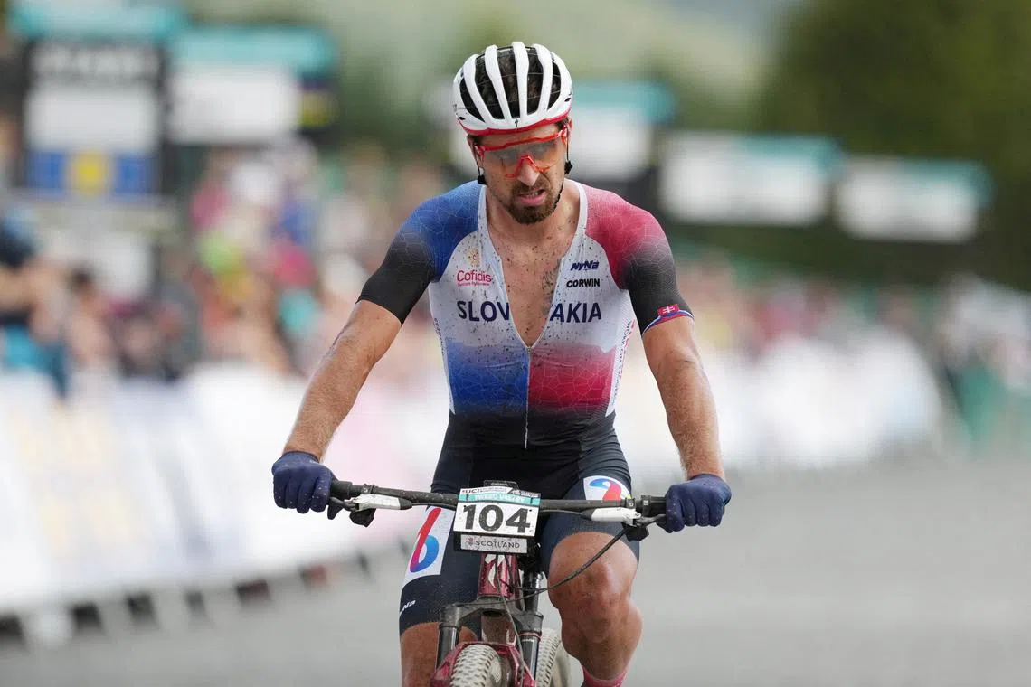 FILE PHOTO: Cycling - UCI World Championships 2023 - Glentress Forest, Peebles, Scotland, Britain - August 12, 2023 Slovakia's Peter Sagan crosses the finish line after the Men's Elite Mountain Bike Cross-country Olympic REUTERS/Maja Smiejkowska