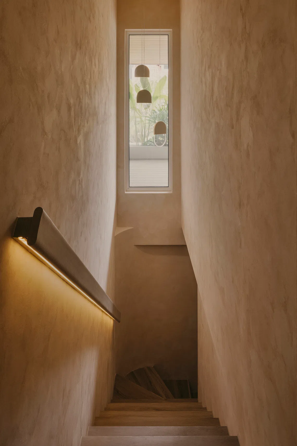 The entire house, including the staircase, is painted in a limewash finish.