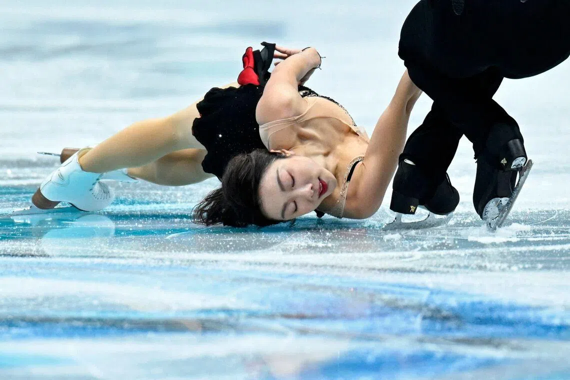 TOPSHOT - Chinas Sui Wenjing (L) and Han Cong performing in the pairs short program during the ISU Figure Skating Four Continents Championships 2026 in Beijing, China on Jan 22, 2026. 