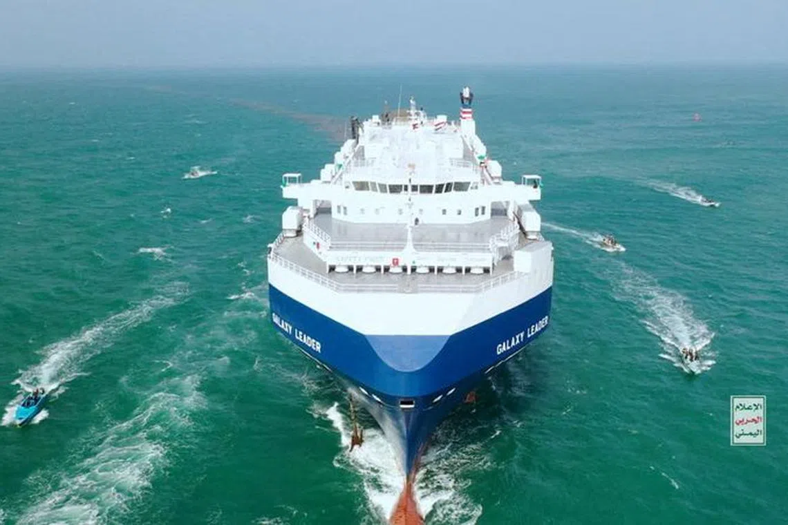 FILE PHOTO: The Galaxy Leader cargo ship is escorted by Houthi boats in the Red Sea in this photo released November 20, 2023. Houthi Military Media/Handout via REUTERS