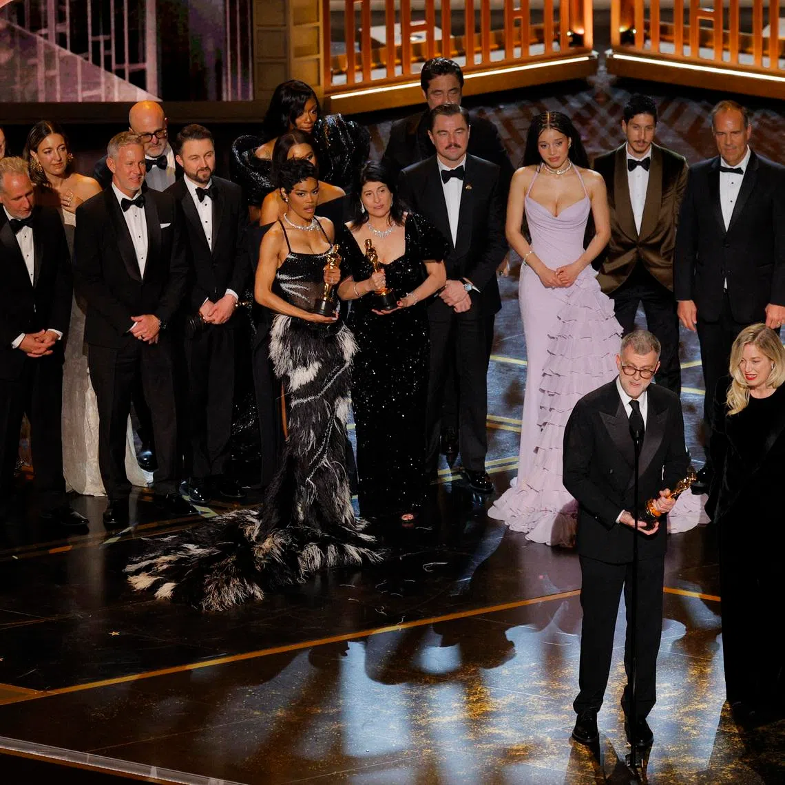 Director Paul Thomas Anderson and the cast and crew celebrate as they accept the Oscar for Best Picture for \"One Battle after Another\" during the Oscars show at the 98th Academy Awards in Hollywood, Los Angeles, California, U.S., March 15, 2026. REUTERS/Mike Blake