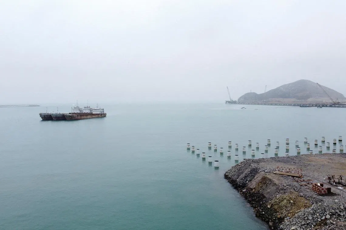 FILE PHOTO: Ships are anchored near the construction site of a new Chinese mega port, in Chancay, Peru August 22, 2023. REUTERS/Angela Ponce/File Photo