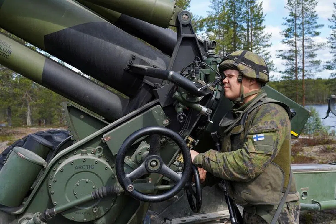 FILE PHOTO: A Finnish soldier operates a towed 155 mm field gun during Northern Forest land force exercise in Rovajarvi, Finland May 30, 2023. REUTERS/Janis Laizans/File Photo
