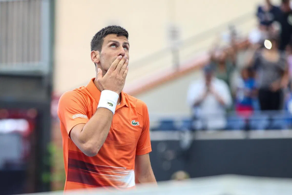 epa10386821 Novak Djokovic of Serbia celebrates victory in his match against Constant Lestienne of France during the 2023 Adelaide International Tennis Tournament at the Memorial Drive Tennis Centre in Adelaide, Australia, 03 January 2023.  EPA-EFE/MATT TURNER AUSTRALIA AND NEW ZEALAND OUT