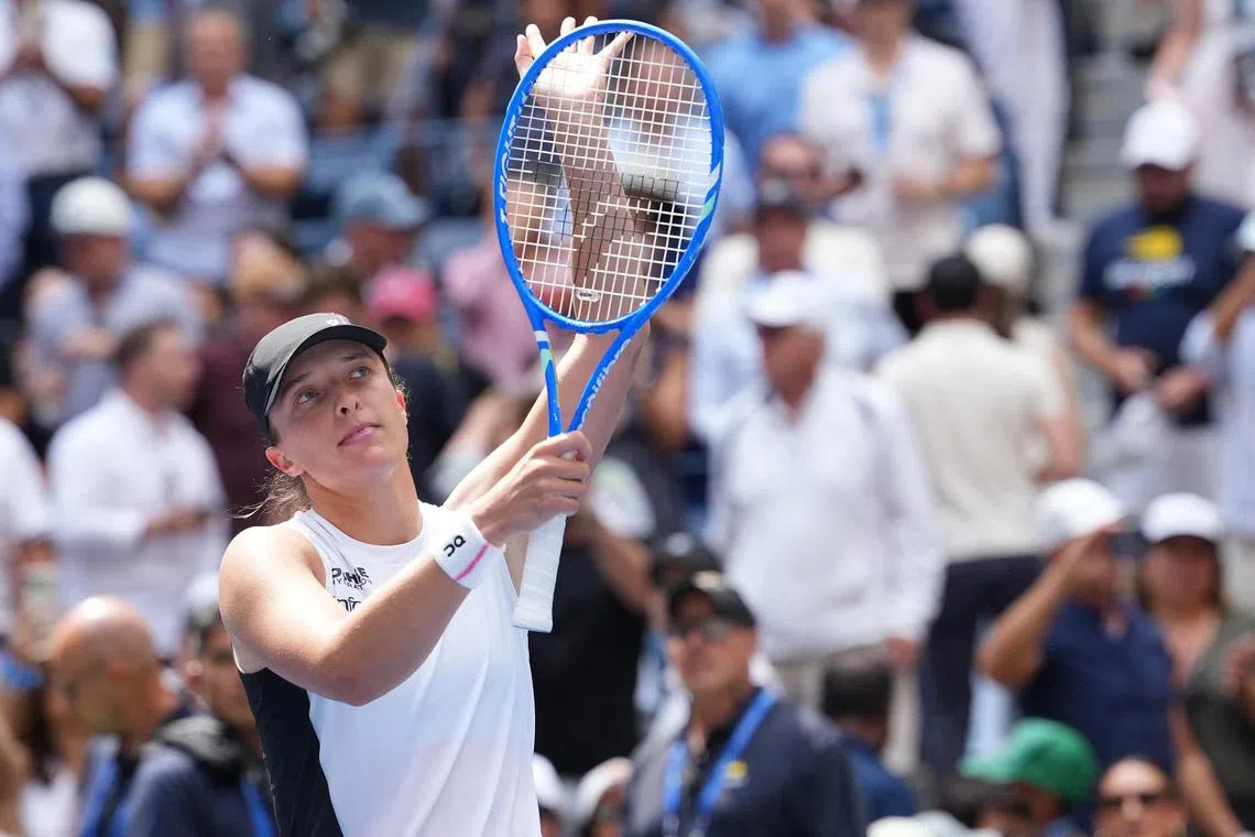 Poland's Iga Swiatek celebrates after beating Suzan Lamens of the Netherlands.