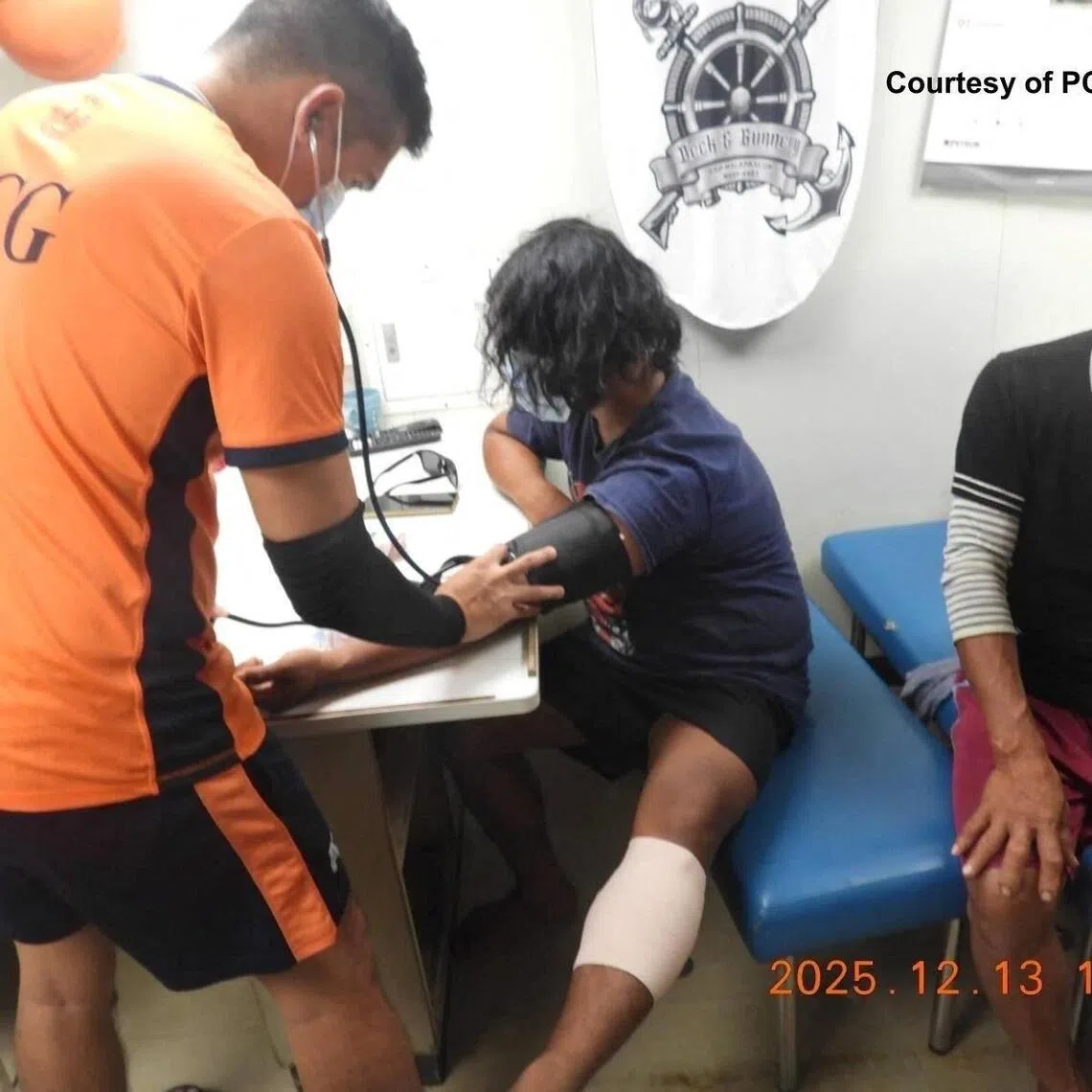 Coast guard personnel attending to injured fishermen after Chinese coast guard ships used water cannon and cut the fishermen's anchor lines near Sabina ​Shoal ​on Dec 12