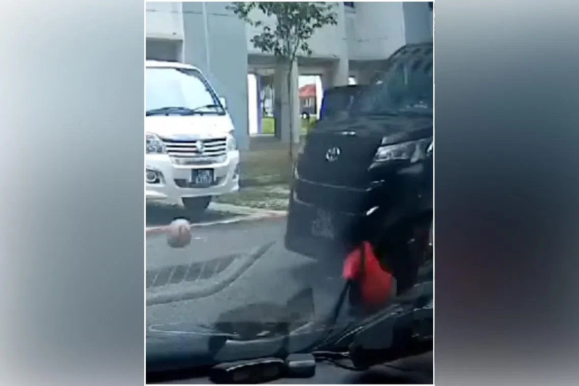 Both the car and the boy travel for a short distance before the car stops abruptly and backs up.