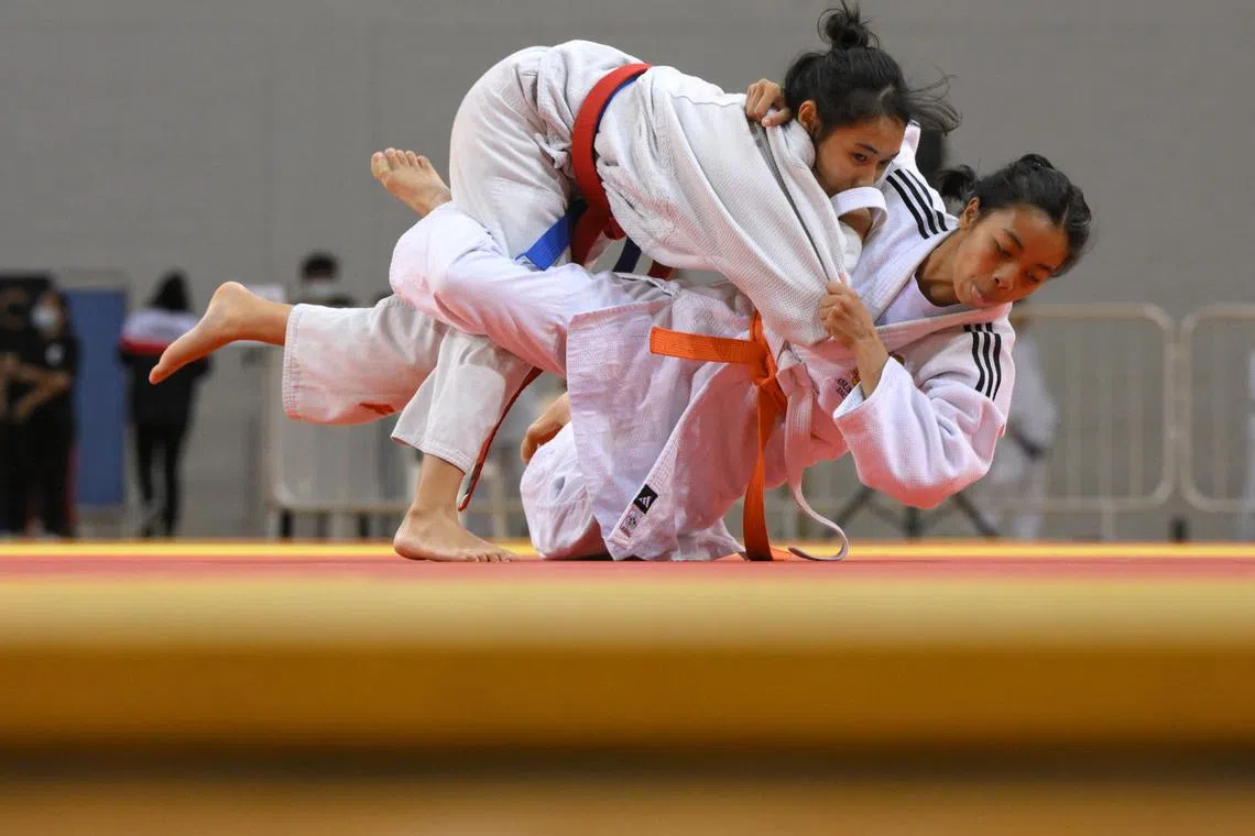 Jullie Anne De La Cruz Tupaz (right) from Assumption English School in action against schoolmate Keira Tatyanna Hadiradewi during the National School Games Judo B Division Girls 45kg (Feather) Final held at the OCBC Arena on May 17, 2024.