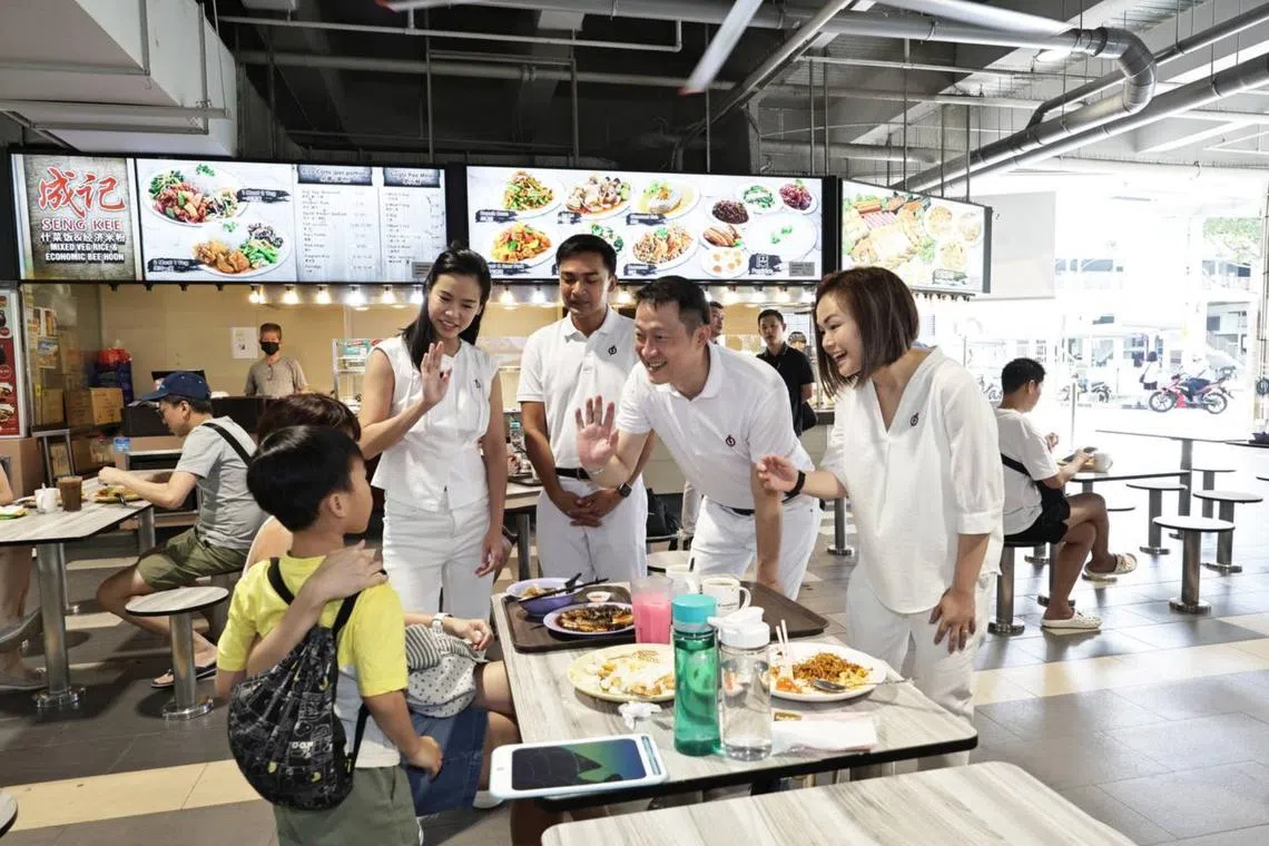 PAP's Sengkang GRC team members (from left) Bernadette Giam Elmie Nekmat, Lam Pin Min and Theodora Lai during a walkabout at Kopitiam Square, on April 20.