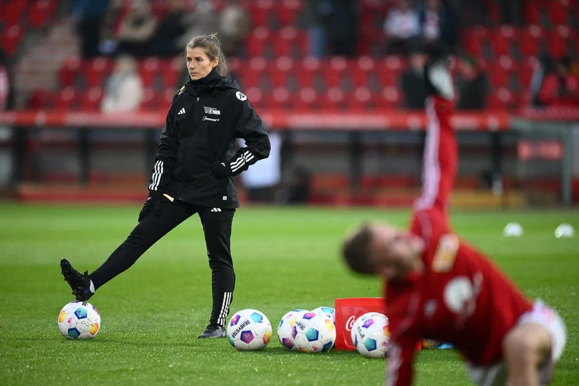 Soccer Football - Bundesliga - 1. FC Union Berlin v FC Augsburg - Stadion An der Alten Forsterei, Berlin, Germany - November 25, 2023 1. FC Union Berlin assistant coach Marie-Louise Eta during the warm up before the match REUTERS/Annegret Hilse /File Photo
