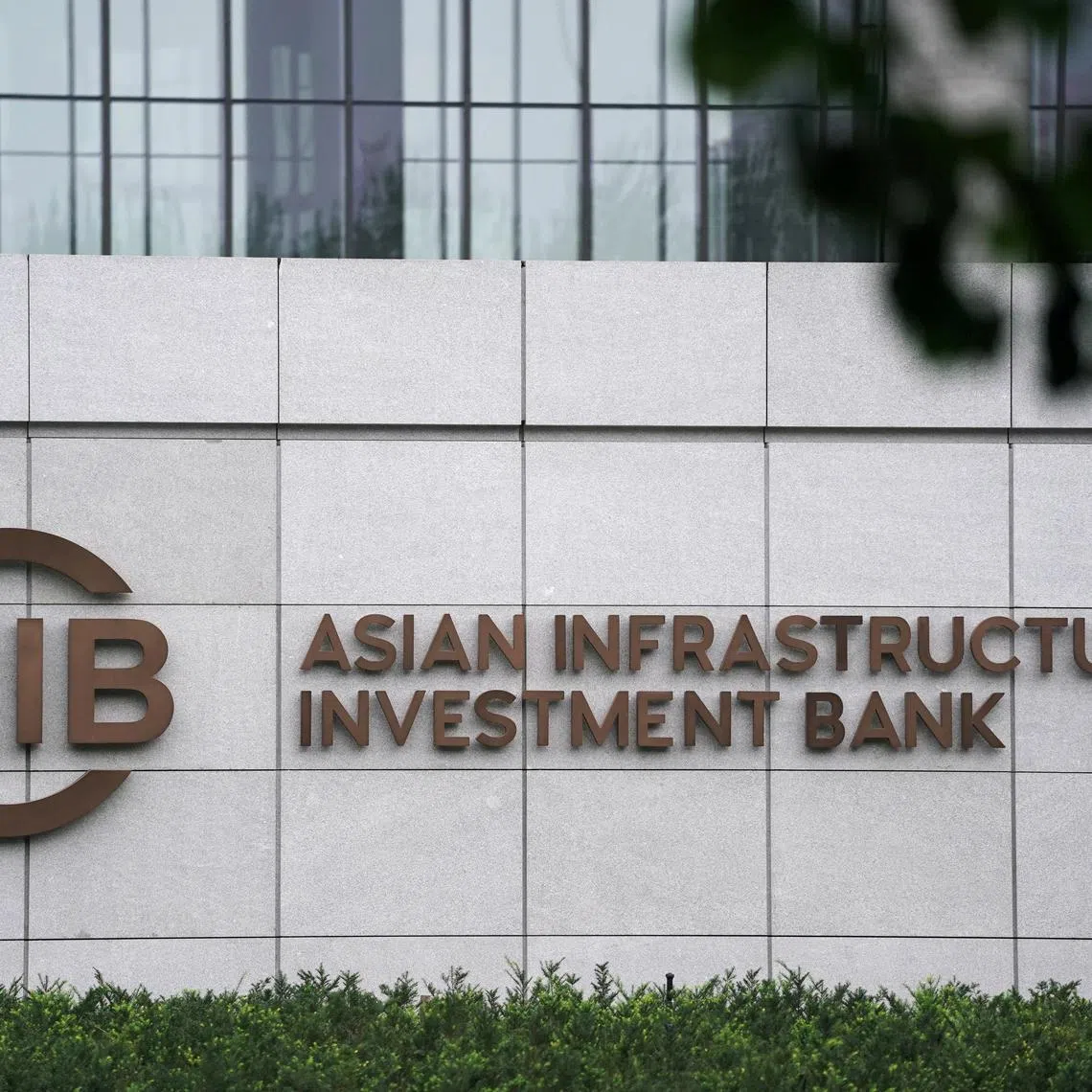 FILE PHOTO: The sign of Asian Infrastructure Investment Bank (AIIB) is pictured at its headquarters in Beijing, China July 27, 2020. REUTERS/Tingshu Wang/File Photo