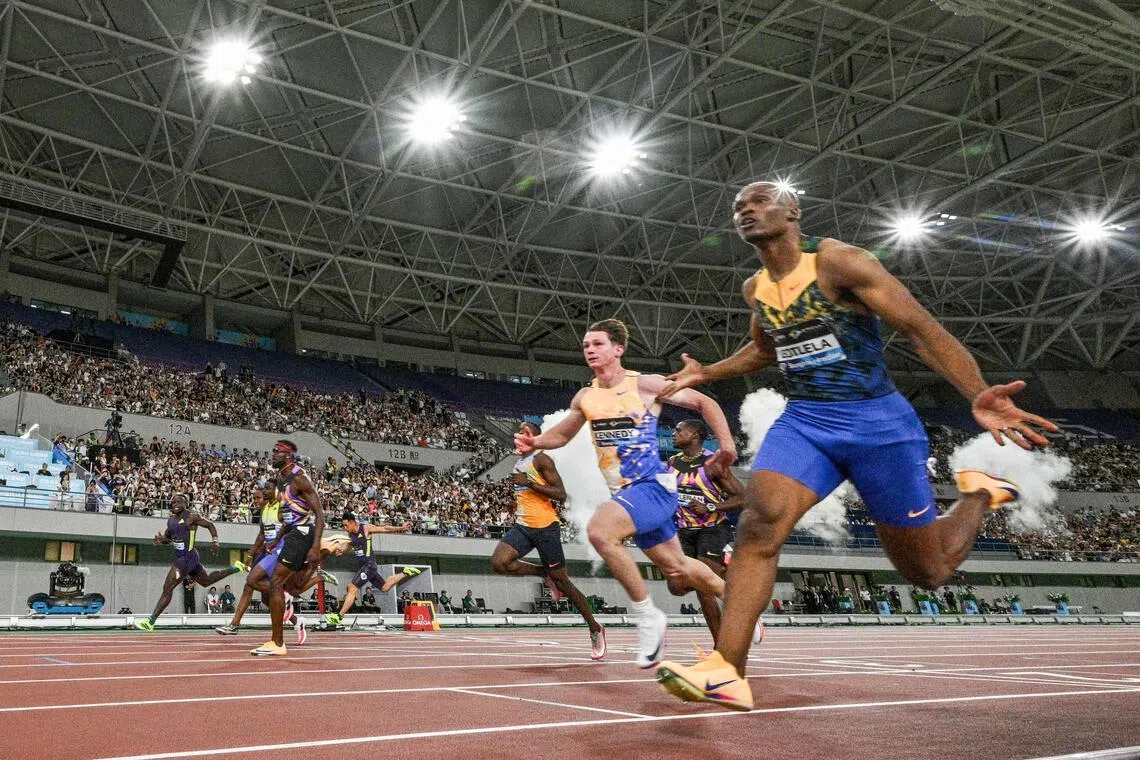 South Africa's Gift Leotlela (right) wins the men's 100m at the Shanghai/Keqiao Diamond League athletics meeting in Keqiao, Shaoxing in China's eastern Zhejiang province on May 16, 2026.