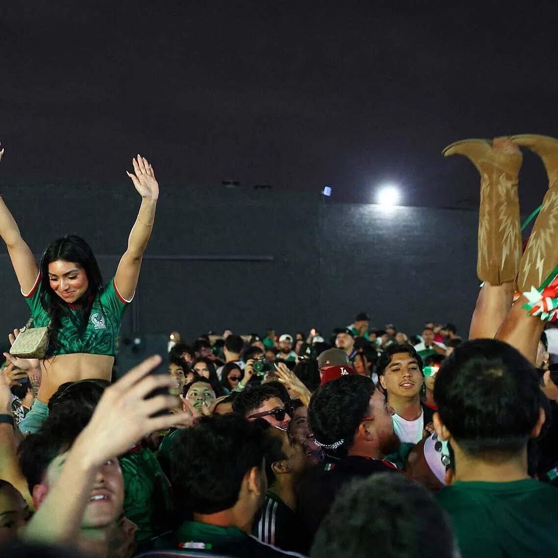 Soccer Football - FIFA World Cup 2026 - Round of 32 - Mexico v Ecuador - Fans gather in Los Angeles - Los Angeles, California, U.S. - June 30, 2026 Mexico fans celebrate at a watch party in Boyle Heights, Los Angeles during the match REUTERS/Lisi Niesner TPX IMAGES OF THE DAY