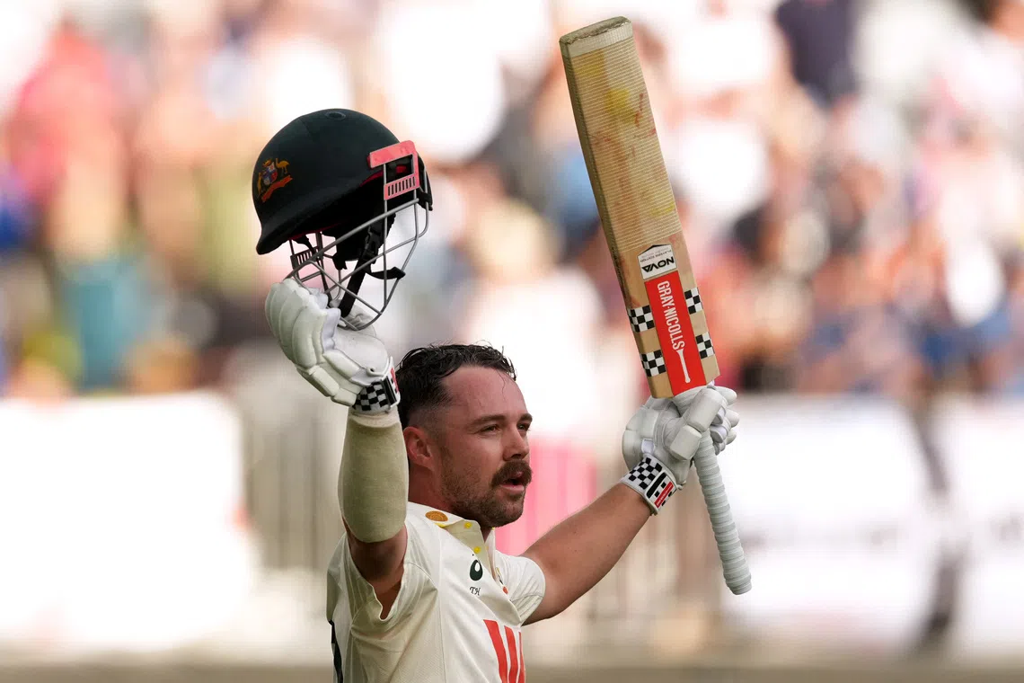 Cricket - The Ashes - Australia v England - First Test - Perth Stadium, Perth, Australia - November 22, 2025 Australia's Travis Head raises his bat as he walks after losing his wicket, caught by England's Ollie Pope off the bowling of Brydon Carse REUTERS/Asanka Brendon Ratnayake