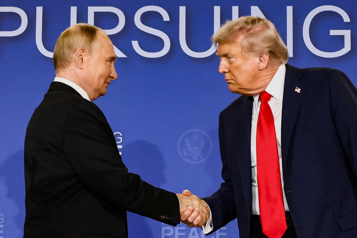 U.S. President Donald Trump and Russian President Vladimir Putin shake hands during a press conference following their meeting to negotiate an end to the war in Ukraine, at Joint Base Elmendorf-Richardson, in Anchorage, Alaska, U.S., August 15, 2025. REUTERS/Kevin Lamarque