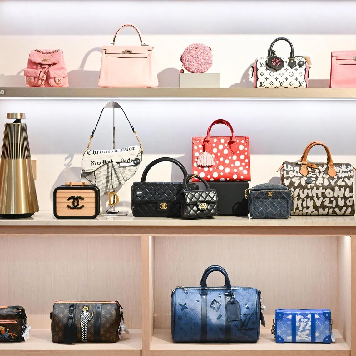 Secondhand designer bags on display inside Carousell Luxury store at The Centrepoint, Orchard Road.