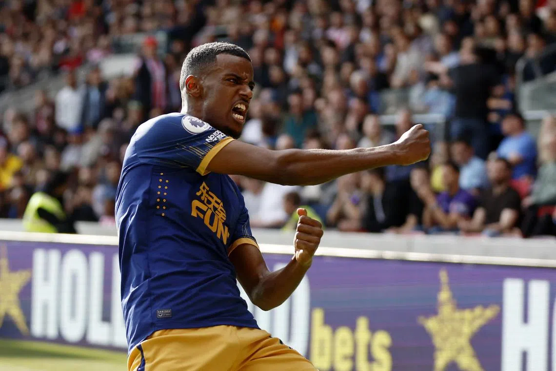 Newcastle United's Alexander Isak celebrates scoring their second goal .