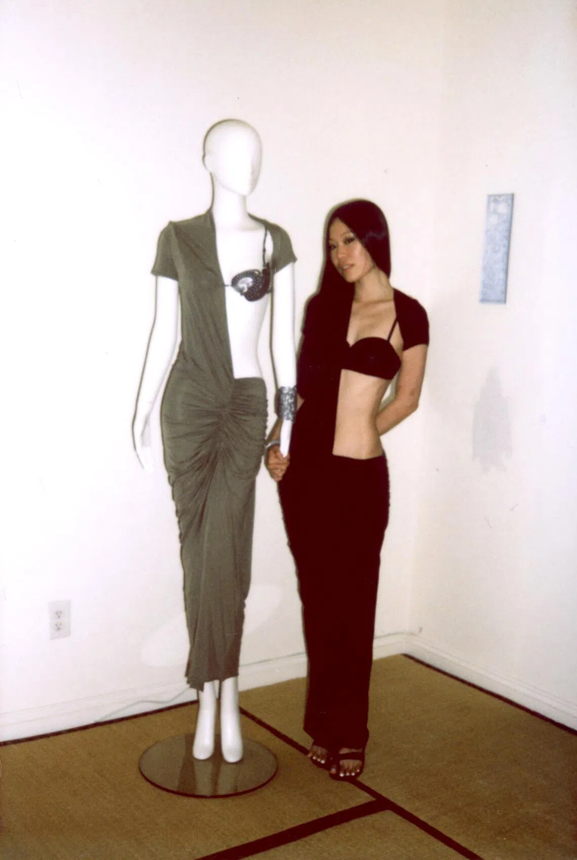 Shawna Wu poses with a mannequin.