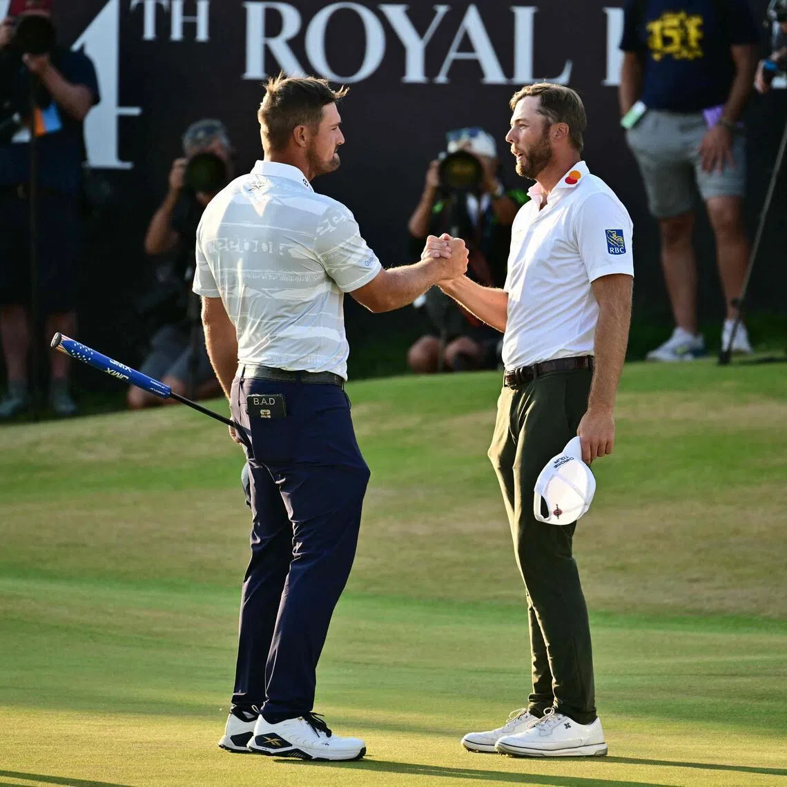 US golfers Bryson DeChambeau (left) and Sam Burns shaking hands on July 18 after their third rounds at the British Open.