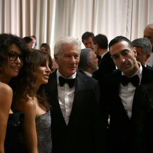 (From left) Italian-Tunisian former model and TV presenter Afef Jnifen, Richard Gere’s wife Alejandra Silva, US actor Richard Gere, Saudi film producer Mohammed Al Turki and Mexican actress Eiza Gonzalez pose after the Giorgio Armani collection show on Sept 28.