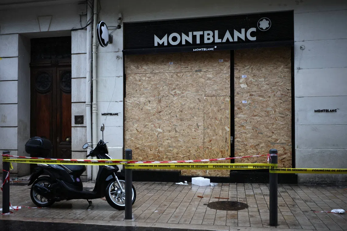 A vandalised Montblanc store with its broken windows boarded up following clashes in Marseille, France, on Oct 19.