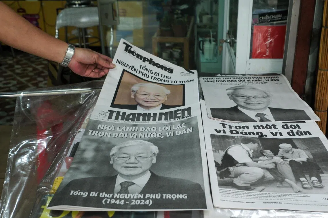 Newspapers with headlines on the death of Mr Nguyen Phu Trong are displayed at a stall in Hanoi, Vietnam, on July 20.
