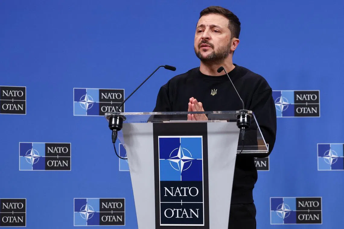 FILE PHOTO: Ukraine's President Volodymyr Zelenskiy attends a press conference, at the NATO headquarters in Brussels, Belgium October 17, 2024. REUTERS/Yves Herman/File Photo