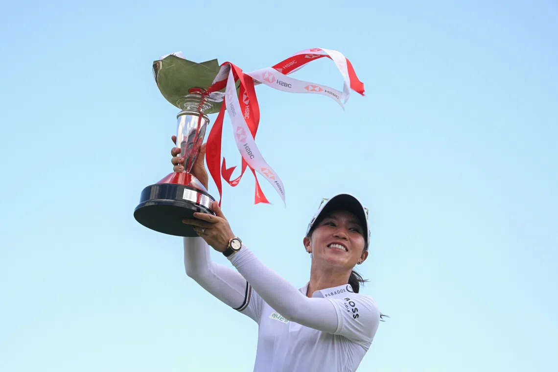 Lydia Ko of New Zealand poses with her trophy at the 18th hole after winning the HSBC Women's World Championship at the Tanjong Golf Course on March 2, 2025.