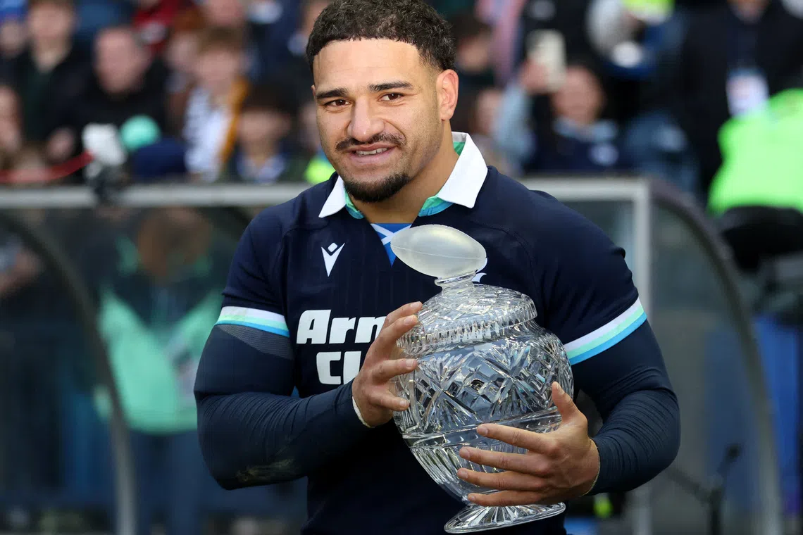 Rugby Union - Autumn Internationals - Scotland v Australia - Scottish Gas Murrayfield Stadium, Edinburgh, Scotland, Britain - November 24, 2024  Scotland's Sione Tuipulotu celebrates with The Hopetoun Cup trophy after the match REUTERS/Russell Cheyne