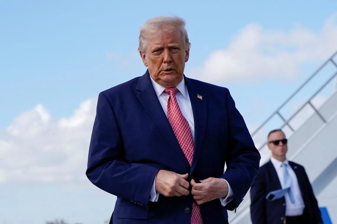 U.S. President Donald Trump walks to speak to reporters as he arrives at Miami International Airport in Miami, Florida, U.S., March 27, 2026. REUTERS/Elizabeth Frantz