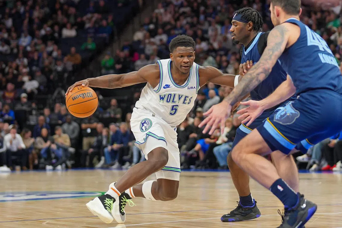Minnesota Timberwolves guard Anthony Edwards dribbles against the Memphis Grizzlies in the second quarter at Target Centre.