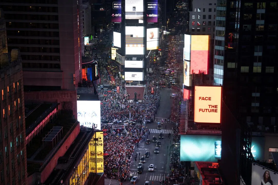 Football fans gather at Time Square for the World Cup final on July 19.