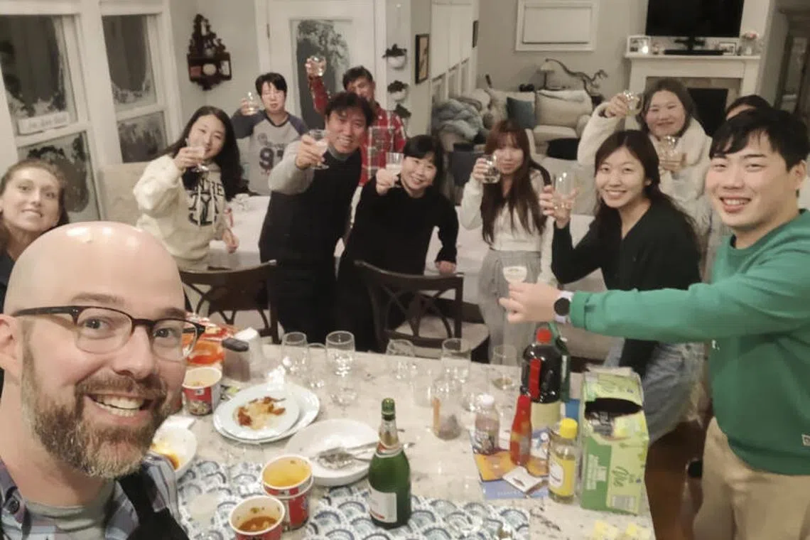 Alexander Campagna and his wife, Andrea, hosting 10 stranded South Korean visitors who were in a tour group headed to Niagara Falls.