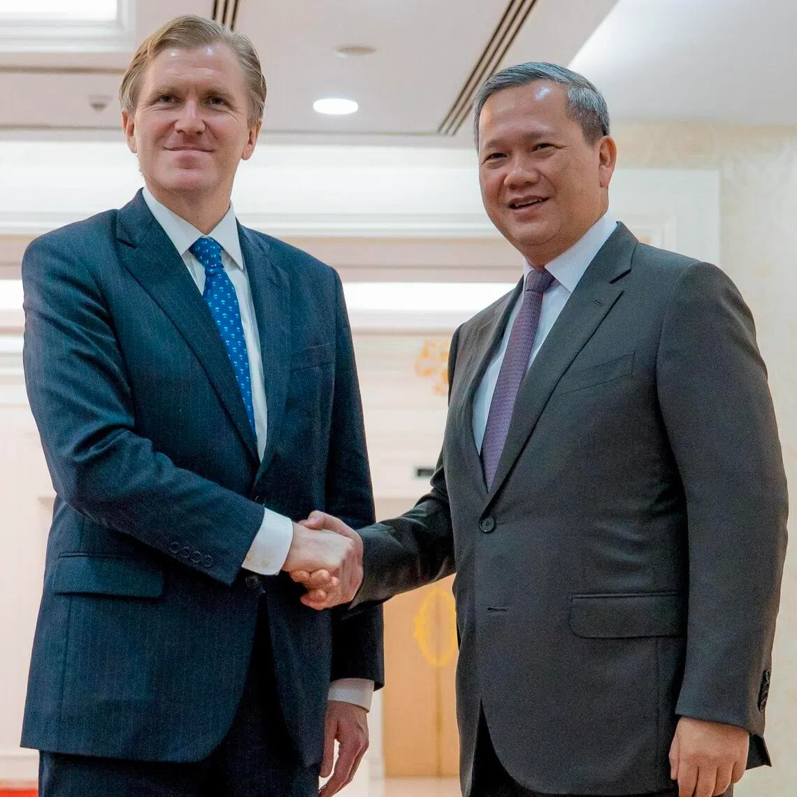 Cambodia Prime Minister Hun Manet (right) and US Under Secretary of Defence Elbridge A. Colby shaking hands during a meeting at the Peace Palace in Phnom Penh, Cambodia, on Aug 14, 2026.