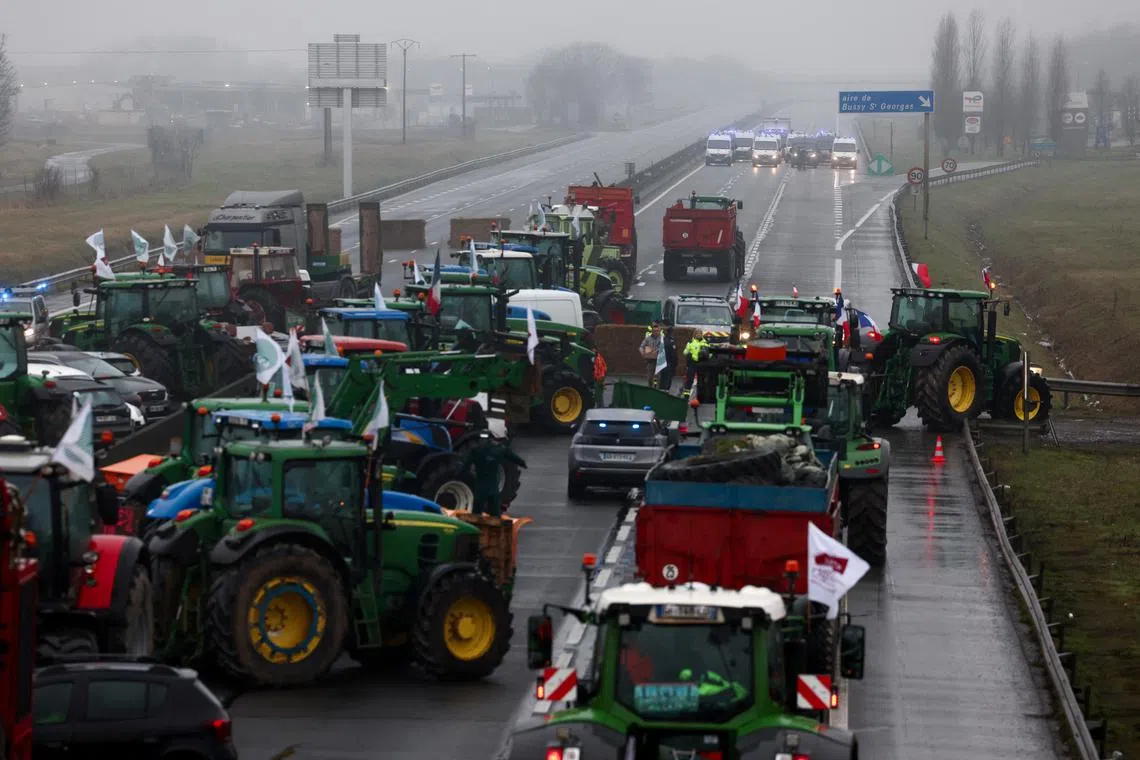 French farmers use their tractors during a protest over price pressures, taxes and green regulation, grievances shared by farmers across Europe, in Jossigny, near Paris, France, February 1, 2024. REUTERS/Stephanie Lecocq/File Photo