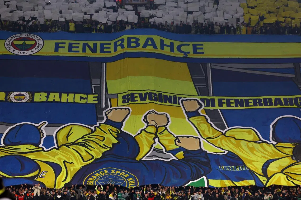 FILE PHOTO: Soccer Football - Super Lig - Fenerbahce v Galatasaray - Sukru Saracoglu Stadium, Istanbul, Turkey - December 1, 2025 Fenerbahce fans display a tifo in the stands before the match REUTERS/Murad Sezer/File Photo