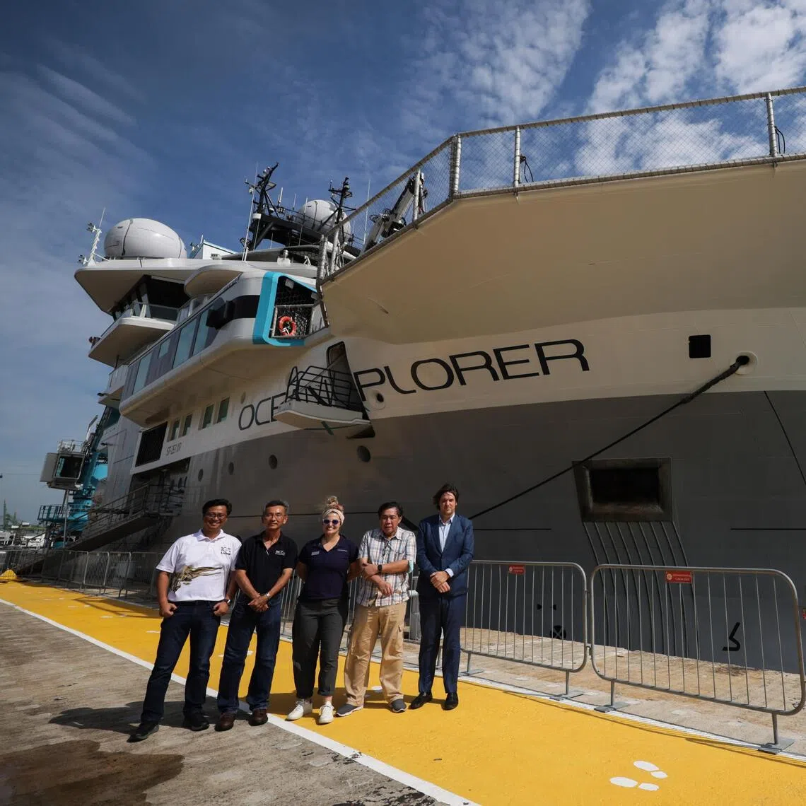 OceanX-NUS research team members Lee Kong Chian Natural History Museum senior research fellow Dr Jose Mendoza, Tropical Marine Science Institute marine biology and ecology laboratory head Dr Tan Koh Siang, OceanX science programme director Mattie Rodrigue, Lee Kong Chian Natural History Museum advisor Prof Peter Ng and OceanX founder and co-CEO Mark Dalio, together with the OceanXplorer scientific vessel at Marina at Keppel Bay on Oct 29, 2025.