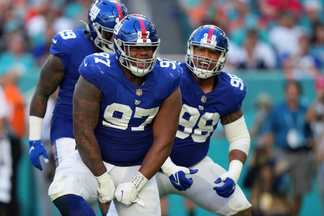 Dec 5, 2021; Miami Gardens, Florida, USA; New York Giants defensive tackle Dexter Lawrence (97) celebrates his tackle of Miami Dolphins running back Salvon Ahmed (not pictured) during the second half at Hard Rock Stadium. Mandatory Credit: Jasen Vinlove-USA TODAY Sports/ File Photo
