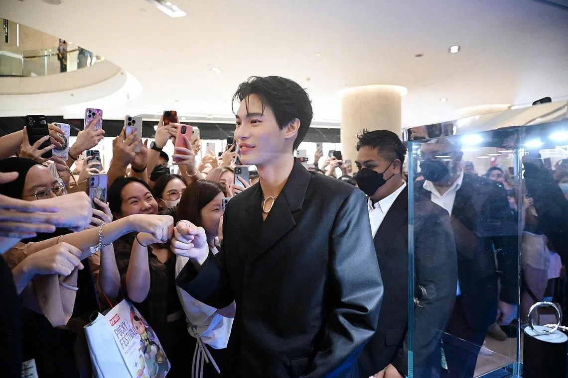 Thai star Win Metawin interacting with his fans while attending a Tiffany event at Ion Orchard on 22 Feb 2023.