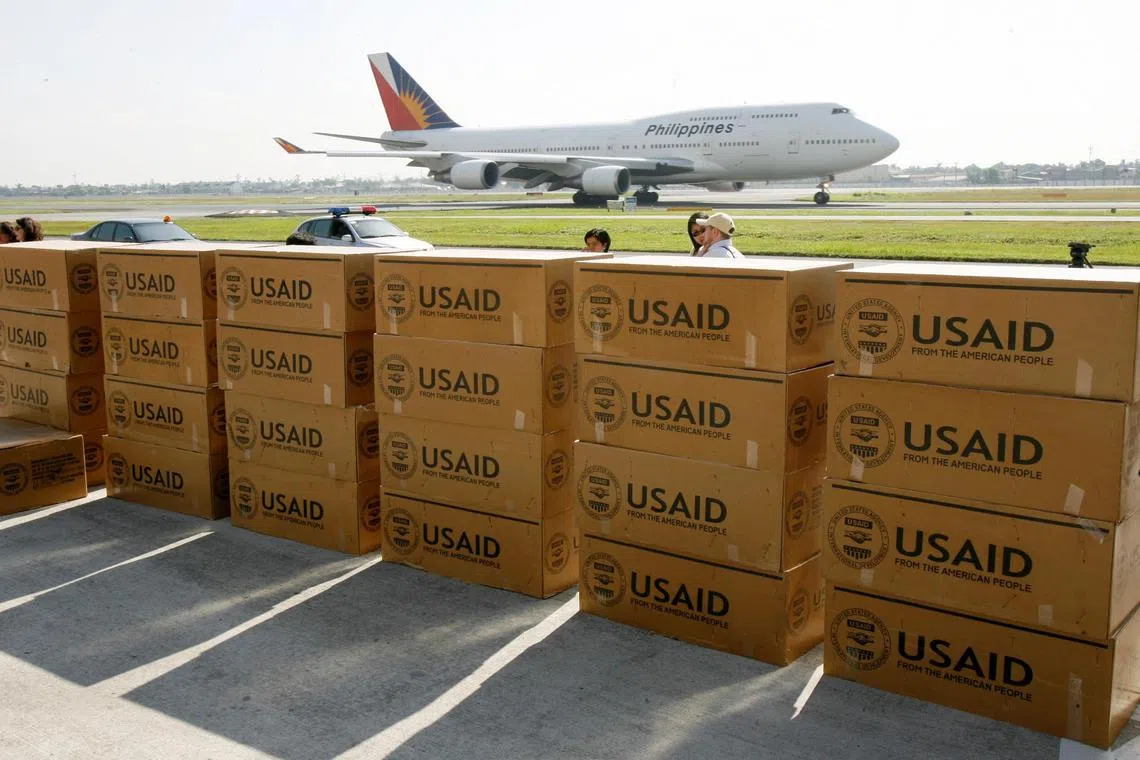 FILE PHOTO: Relief supplies for families affected by Typhoon Durian arrive at the Manila international airport December 7, 2006. Americans, through the U.S. Agency for International Development (USAID), provided disaster relief and assistance to the Philippines after it was severely hurt by Typhoon Durian that killed 570 people and destroyed nearly 250,000 houses.  REUTERS/Romeo Ranoco (PHILIPPINES)/File Photo
