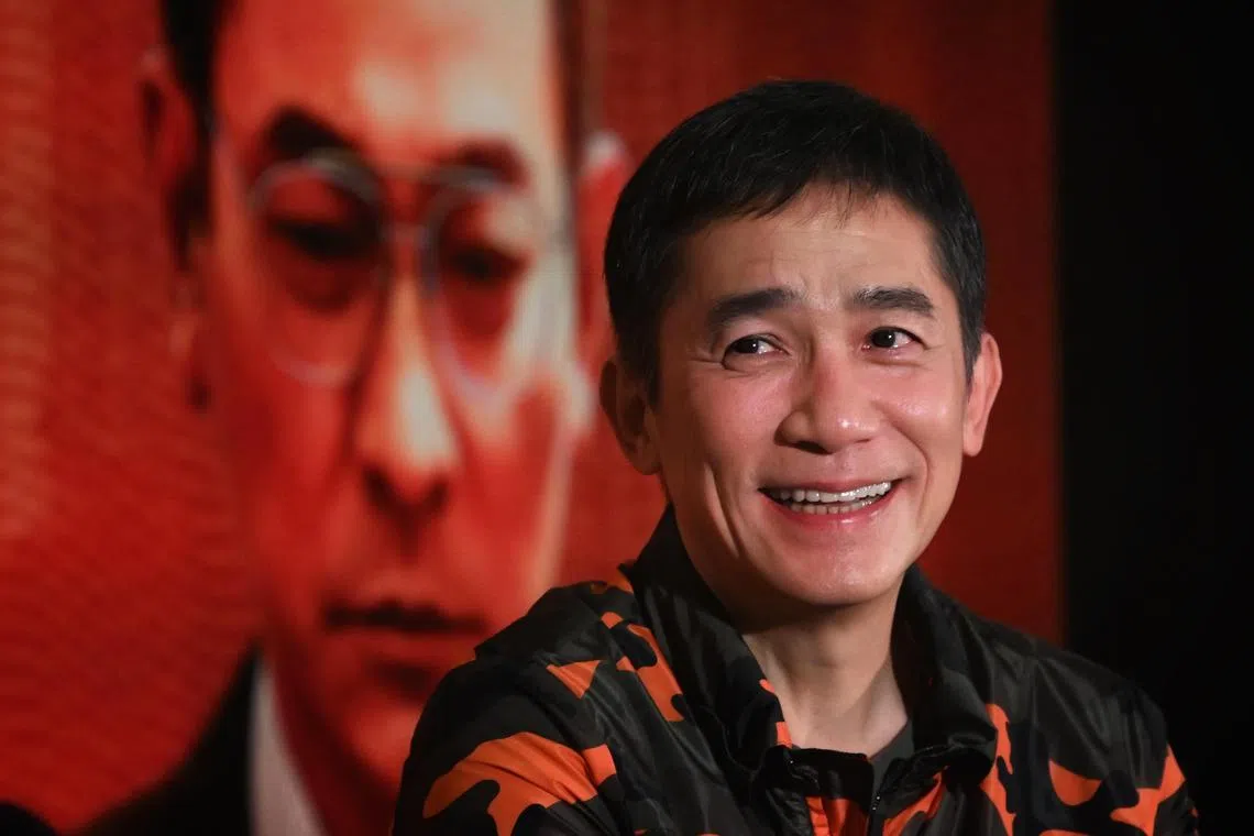 Slug: jstony21
ST PHOTO: Chong Jun Liang

Hong Kong actor Tony Leung photographed against a banner of co-star Andy Lau,at a press conference for the movie, The Goldfinger on December 21, 2023. 

*****
Tony Leung will be in Singapore to promote his new movie The Goldfinger. 
I will be covering the press conference and Kim Hoh will have 1-1 interview sessions with Tony Leung, and director-writer Felix Chong   producer Ronald Wong.