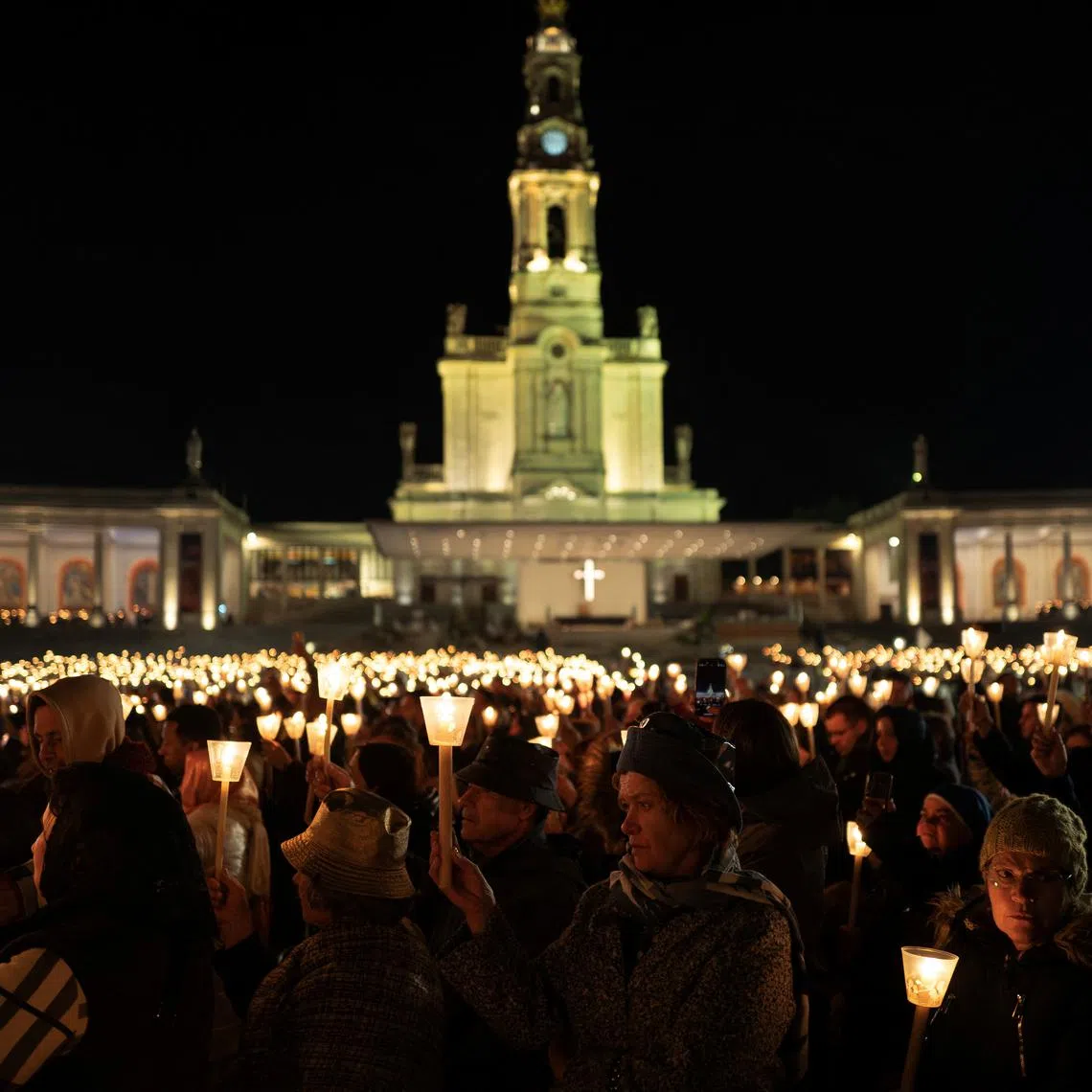 Pilgrims participate in the candlelight procession on the eve of the anniversary of the reported appearance of the Virgin Mary to three shepherd children, at the Catholic shrine of Fatima, Portugal, May 12, 2025. REUTERS/Pedro Nunes