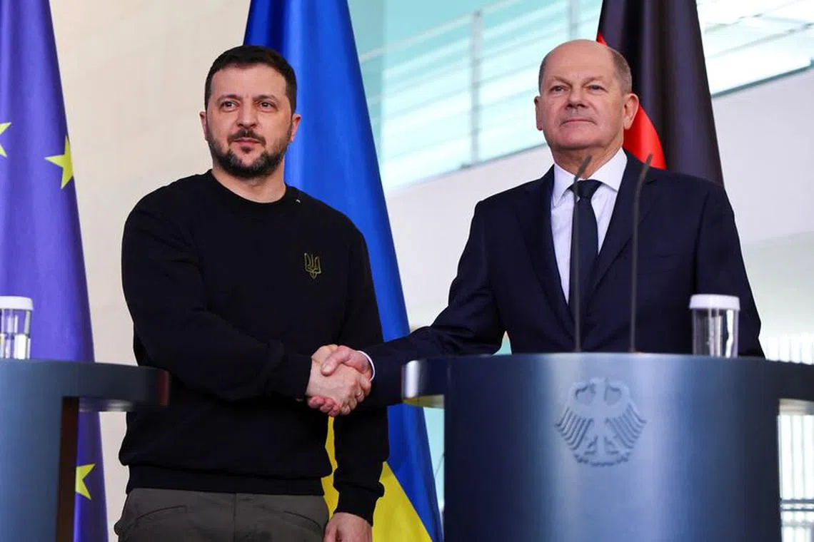 German Chancellor Olaf Scholz and Ukraine's President Volodymyr Zelenskiy shake hands at a press conference in Berlin, Germany, February 16, 2024. REUTERS/Fabrizio Bensch