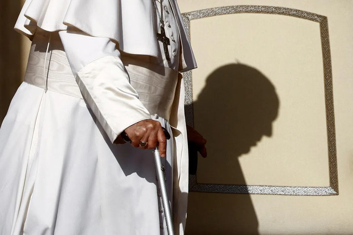 Pope Francis walking on the day of the weekly general audience, in Saint Peter's Square at the Vatican, Sept 27.