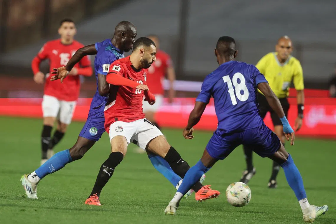 Soccer Football - African Qualifiers - Egypt v Sierra Leone - Cairo International Stadium, Cairo, Egypt - March 25, 2025 Egypt's Mohamed Salah in action with Sierra Leone's Sallieu Tarawallie REUTERS/Mohamed Abd El Ghany
