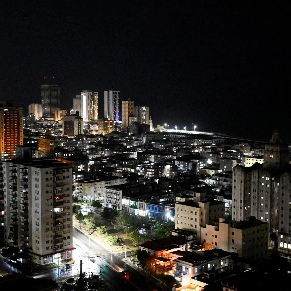 Buildings and street lights illuminate the night as Cubans this week began to reap the benefits of a recent 100,000 metric ton delivery of Russian oil, a temporary lifeline for the energy-starved nation and the first major shipment of oil to the island since the United States moved to cut off its fuel early this year, in Havana, Cuba, April 23, 2026. REUTERS/Norlys Perez