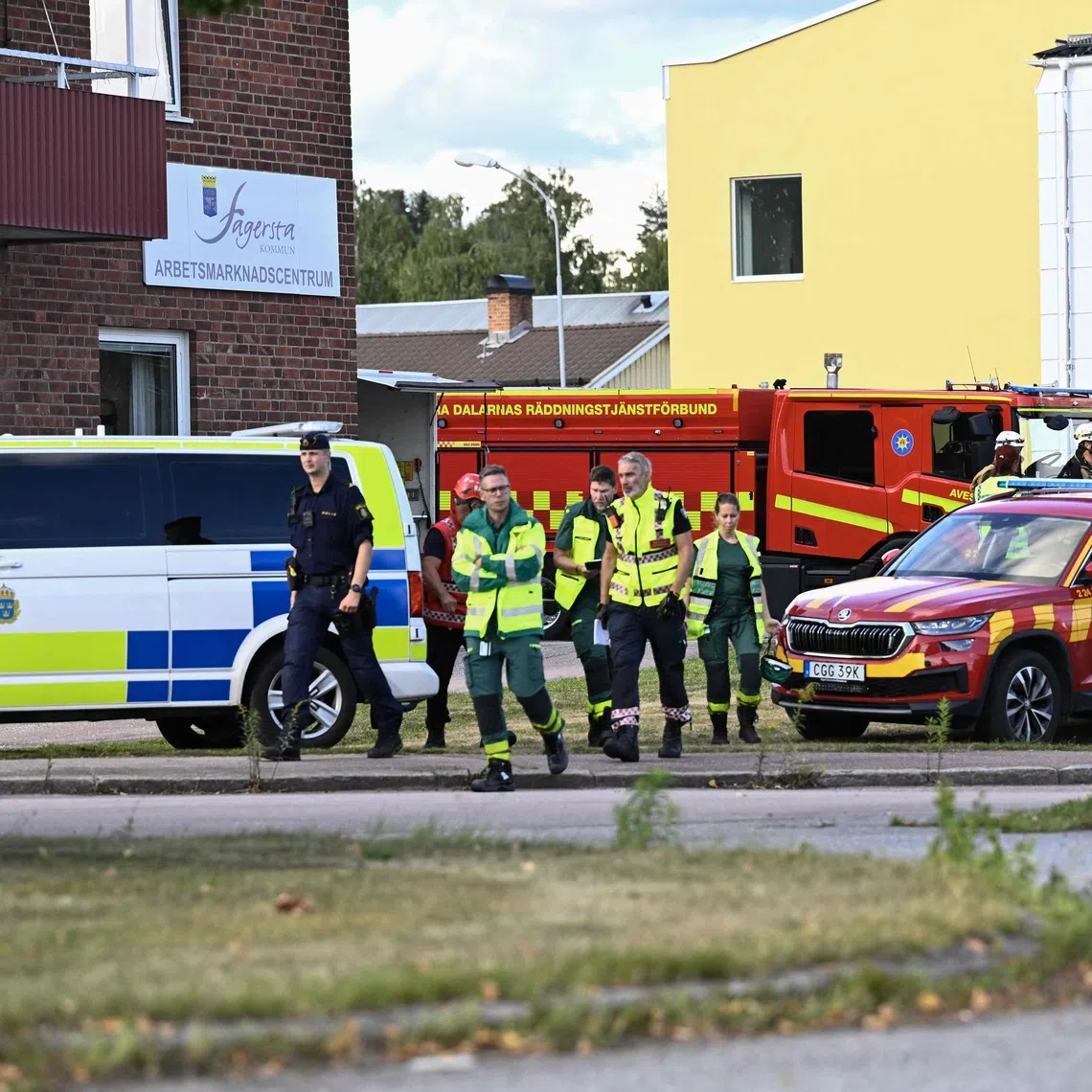 Police officers and rescue services working at the scene of a sword attack at a high school in Fagersta, central Sweden, on Aug 21.