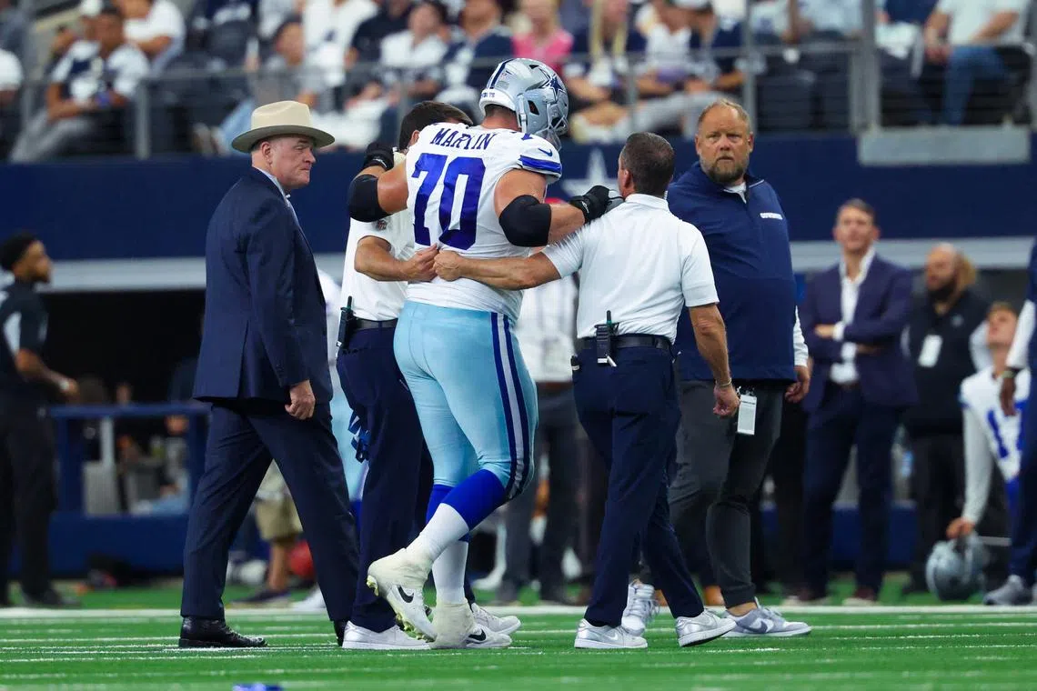 FILE PHOTO: Sep 15, 2024; Arlington, Texas, USA; Dallas Cowboys guard Zack Martin (70) walsk off injured during the second half against the New Orleans Saints at AT&T Stadium. Kevin Jairaj-Imagn Images/File Photo